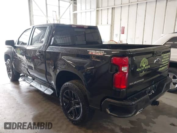 2024 Chevrolet Silverado 1500 LT Trail Boss with VIN 3GCUDFE83RG309753, listed as a IAAI auction lot 43305258 with 28,478 mi miles and . Bid and sale history available at DreamBid. Image 3.