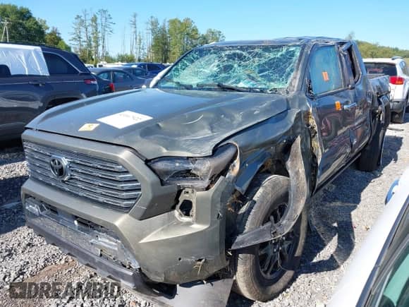 2024 Toyota Tacoma SR5 with VIN 3TMLB5JN3RM069502, listed as a IAAI auction lot 43167922 with 9,100 mi miles and . Bid and sale history available at DreamBid. Image 2.