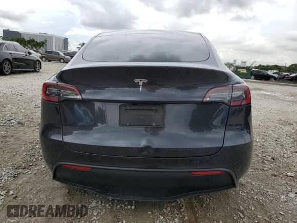 2024 Tesla Model Y с VIN 7SAYGDED6RF018828, выставлен на аукционе Copart как лот 71609855 с пробегом 21 820 миль миль и На запчасти • Non repairable. История ставок и продаж доступна на DreamBid. Изображение 6.
