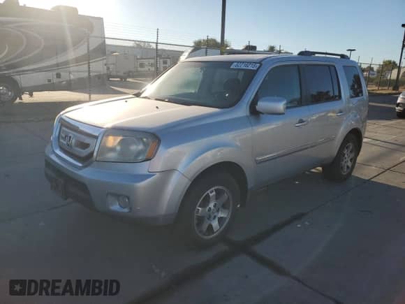 2010 Honda Pilot Touring with VIN 5FNYF4H97AB006893, listed as a Copart auction lot 82216215 with 237,897 mi miles and Salvage title. Bid and sale history available at DreamBid. Image 1.