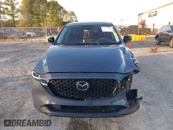 2022 Mazda CX-5 S Carbon Edition z VIN JM3KFBCM3N0537011, wystawiony jako IAAI lot #41472429 z przebiegiem 31 498 mil mil oraz . Historia ofert i sprzedaży dostępna na DreamBid. Obrazek 12.