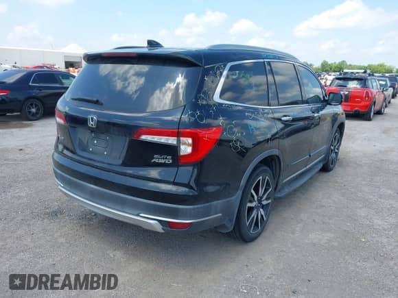 2020 Honda Pilot Elite with VIN 5FNYF6H0XLB032663, listed as a IAAI auction lot 42336547 with 102,386 mi miles and . Bid and sale history available at DreamBid. Image 4.