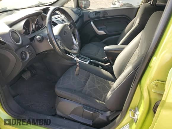 2011 Ford Fiesta SES with VIN 3FADP4FJ5BM157100, listed as a Copart auction lot 82081325 with 77,710 mi miles and Salvage title. Bid and sale history available at DreamBid. Image 7.