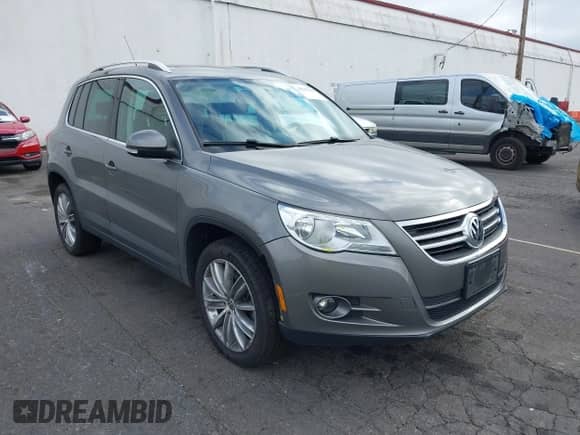 2011 Volkswagen Tiguan S with VIN WVGBV7AX1BW537860, listed as a IAAI auction lot 43047660 with 93,764 mi miles and . Bid and sale history available at DreamBid. Image 1.