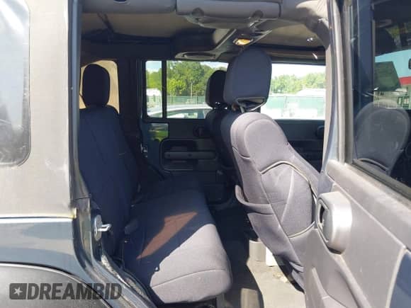 2008 Jeep Wrangler Unlimited Sahara with VIN 1J4GA59128L607591, listed as a IAAI auction lot 42959722 with 129,564 mi miles and . Bid and sale history available at DreamBid. Image 8.