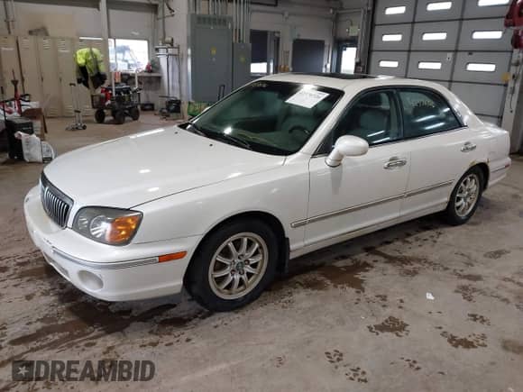 2003 Hyundai XG z VIN KMHFU45E93A265584, wystawiony jako IAAI lot #42370726 z przebiegiem 223 254 mil mil oraz . Historia ofert i sprzedaży dostępna na DreamBid. Obrazek 2.