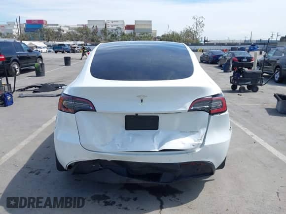 2022 Tesla Model Y Long Range z VIN 7SAYGDEE0NF451306, wystawiony jako IAAI lot #43253038 z przebiegiem 49 961 mil mil oraz . Historia ofert i sprzedaży dostępna na DreamBid. Obrazek 17.