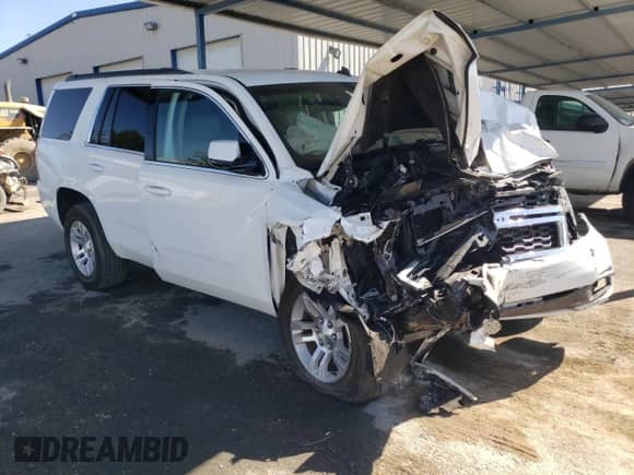 2015 Chevrolet Tahoe LT with VIN 1GNSKBKC2FR182883, listed as a Copart auction lot 70604715 with Not provided miles and Salvage title. Bid and sale history available at DreamBid. Image 4.