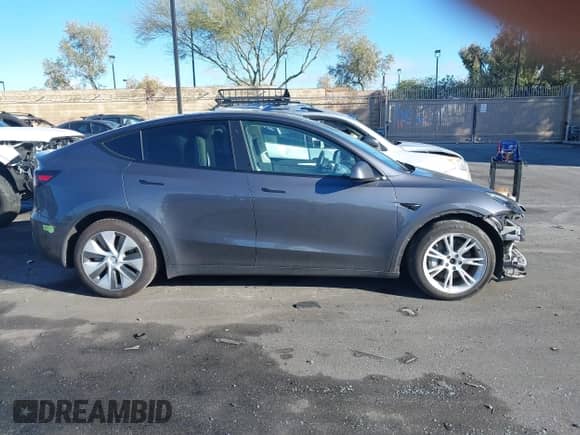 2023 Tesla Model Y Long Range with VIN 7SAYGAEE9PF662232, listed as a IAAI auction lot 43442303 with 42,636 mi miles and . Bid and sale history available at DreamBid. Image 14.