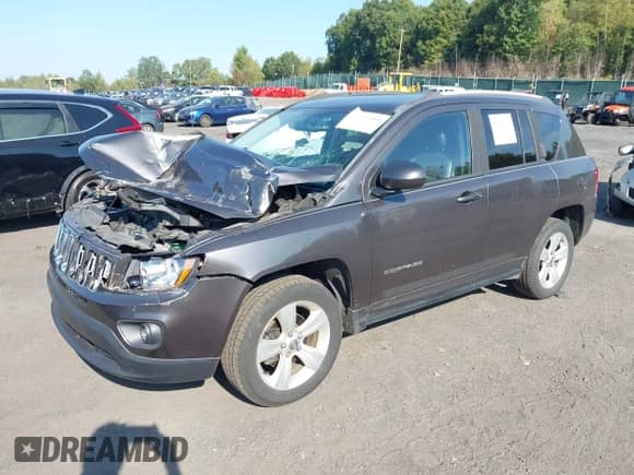 2016 Jeep Compass Latitude with VIN 1C4NJDEB9GD598368, listed as a IAAI auction lot 43222103 with 83,372 mi miles and . Bid and sale history available at DreamBid. Image 2.