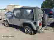 2000 Jeep Wrangler SE with VIN 1J4FA29P4YP775935, listed as a Copart auction lot 80458955 with 100,211 mi miles and Salvage title. Bid and sale history available at DreamBid. Image 2.