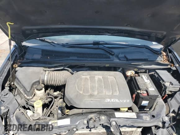 2013 Dodge Grand Caravan R/T с VIN 2C4RDGEG4DR735943, выставлен на аукционе Copart как лот 66855335 с пробегом 175 727 миль миль и Списание • Salvage title. История ставок и продаж доступна на DreamBid. Изображение 12.
