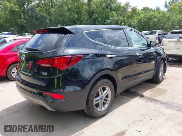 2018 Hyundai Santa Fe 2.4L with VIN 5NMZTDLBXJH057892, listed as a IAAI auction lot 42953917 with 89,397 mi miles and . Bid and sale history available at DreamBid. Image 4.