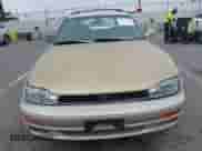 1992 Toyota Camry z VIN 4T1SK12W4NU110507, wystawiony jako IAAI lot #42236165 z przebiegiem 234 147 mil mil oraz . Historia ofert i sprzedaży dostępna na DreamBid. Obrazek 12.