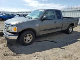 2003 Ford F-150 XL with VIN 1FTRX17L43NA66874, listed as a Copart auction lot 50741395 with 196,161 mi miles and Salvage title. Bid and sale history available at DreamBid. Image 1.