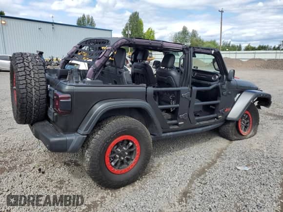 2023 Jeep Wrangler Rubicon 20th Anniversary with VIN 1C4JJXSJ3PW642395, listed as a Copart auction lot 67934925 with 21,587 mi miles and Salvage title. Bid and sale history available at DreamBid. Image 3.