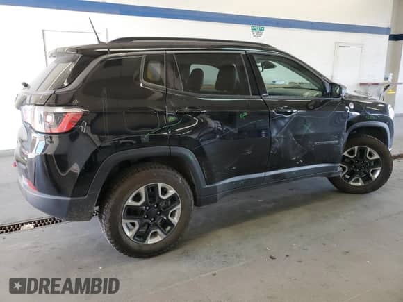 2017 Jeep Compass Trailhawk with VIN 3C4NJDDBXHT647011, listed as a Copart auction lot 65583185 with 106,438 mi miles and Salvage title. Bid and sale history available at DreamBid. Image 3.