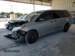 2014 Toyota Sienna L with VIN 5TDZK3DC9ES494614, listed as a Copart auction lot 57758975 with 147,221 mi miles and Salvage title. Bid and sale history available at DreamBid. Image 1.