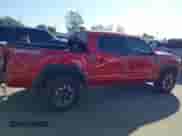 2021 Toyota Tacoma SR z VIN 5TFCZ5AN0MX262902, wystawiony jako IAAI lot #43535009 z przebiegiem 70 926 mil mil oraz . Historia ofert i sprzedaży dostępna na DreamBid. Obrazek 12.