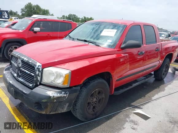 2005 Dodge Dakota SLT with VIN 1D7HE48N65S209630, listed as a IAAI auction lot 42409822 with 224,849 mi miles and . Bid and sale history available at DreamBid. Image 2.