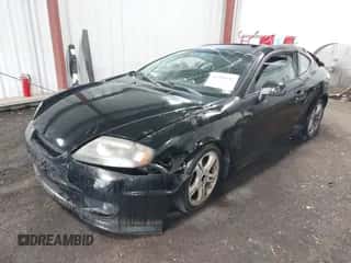2005 Hyundai Tiburon GT с VIN KMHHN65F45U184777, выставлен на аукционе IAAI как лот 42190342 с пробегом 213 013 миль миль и . История ставок и продаж доступна на DreamBid. Изображение 2.