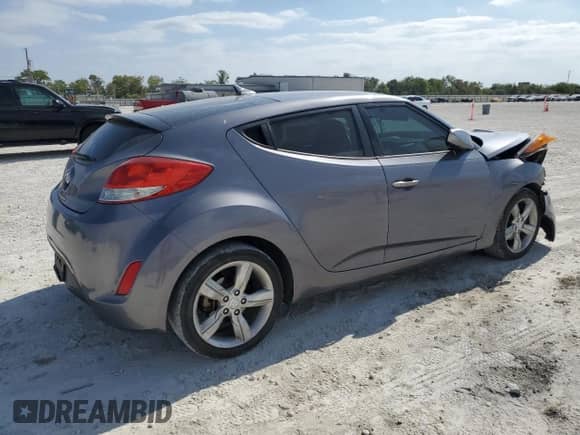 2013 Hyundai Veloster w/Black Int z VIN KMHTC6AD0DU094688, wystawiony jako Copart lot #87237165 z przebiegiem 81 433 mil mil oraz Szkoda całkowita • Salvage title. Historia ofert i sprzedaży dostępna na DreamBid. Obrazek 3.