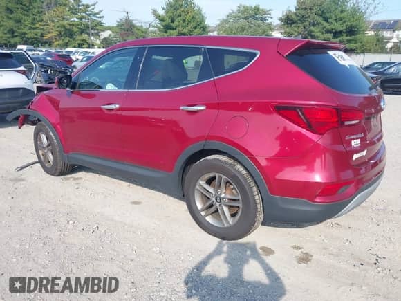 2018 Hyundai Santa Fe 2.4L z VIN 5XYZTDLB2JG556213, wystawiony jako IAAI lot #43272986 z przebiegiem 105 475 mil mil oraz . Historia ofert i sprzedaży dostępna na DreamBid. Obrazek 3.