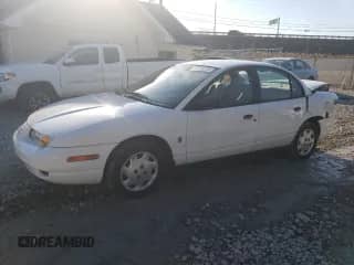 2000 Saturn SL with VIN 1G8ZH5281YZ240482, listed as a Copart auction lot 47728225 with 144,946 mi miles and Salvage title. Bid and sale history available at DreamBid. Image 1.
