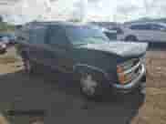 1999 Chevrolet Tahoe with VIN 1GNEK13R0XJ560757, listed as a Copart auction lot 64959415 with 187,008 mi miles and Salvage title. Bid and sale history available at DreamBid. Image 4.