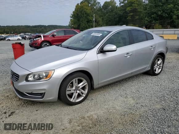 2015 Volvo S60 T5 Drive-E Premier with VIN YV140MFK9F2357136, listed as a Copart auction lot 80853495 with 106,284 mi miles and Salvage title. Bid and sale history available at DreamBid. Image 1.
