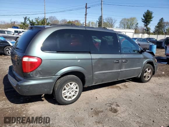 2004 Dodge Caravan SE with VIN 1D4GP24R04B520727, listed as a Copart auction lot 52002475 with 164,954 mi miles and Salvage title. Bid and sale history available at DreamBid. Image 3.