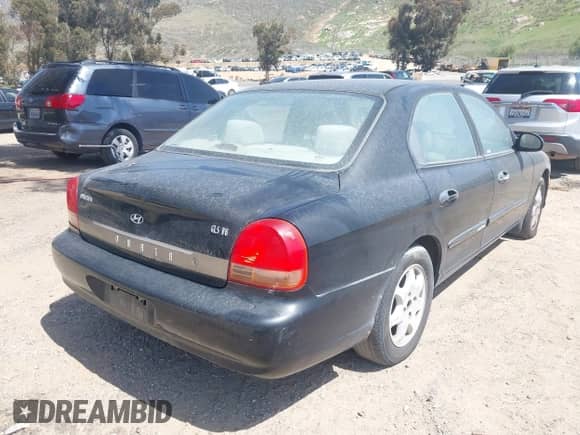 2001 Hyundai Sonata GLS z VIN KMHWF35V31A458928, wystawiony jako IAAI lot #41944264 z przebiegiem 118 398 mil mil oraz . Historia ofert i sprzedaży dostępna na DreamBid. Obrazek 4.