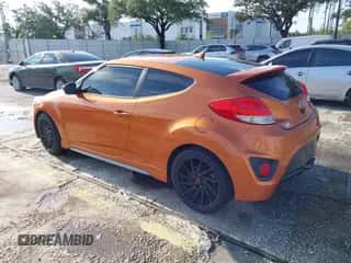 2016 Hyundai Veloster Turbo z VIN KMHTC6AE0GU273097, wystawiony jako IAAI lot #43161179 z przebiegiem 149 883 mil mil oraz . Historia ofert i sprzedaży dostępna na DreamBid. Obrazek 3.