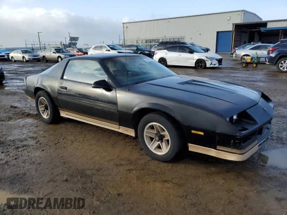 1984 Chevrolet Camaro Z28 Sport with VIN 1G1AP87G7EL175104, listed as a Copart auction lot 86895534 with 27,874 mi miles and Salvage title. Bid and sale history available at DreamBid. Image 4.