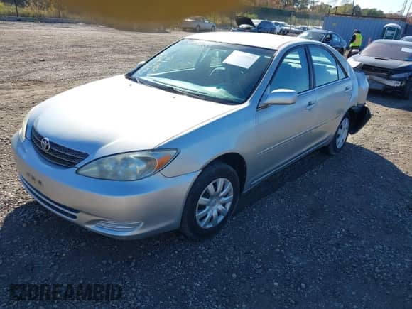 2003 Toyota Camry LE with VIN 4T1BE32K53U769449, listed as a IAAI auction lot 43520963 with 182,379 mi miles and . Bid and sale history available at DreamBid. Image 2.