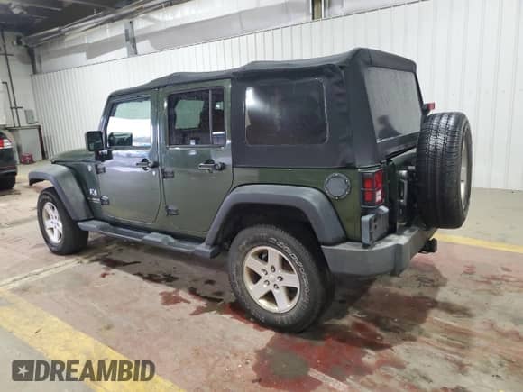 2008 Jeep Wrangler Unlimited X with VIN 1J4GA39158L583789, listed as a Copart auction lot 86292065 with 170,334 mi miles and Salvage title. Bid and sale history available at DreamBid. Image 2.