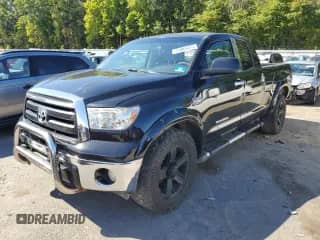 2010 Toyota Tundra with VIN 5TFUM5F12AX006488, listed as a Copart auction lot 71805415 with 142,452 mi miles and Salvage title. Bid and sale history available at DreamBid. Image 1.