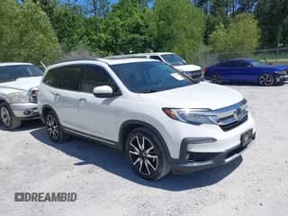 2021 Honda Pilot Touring 8-Passenger z VIN 5FNYF5H98MB037807, wystawiony jako IAAI lot #42136047 z przebiegiem 80 990 mil mil oraz . Historia ofert i sprzedaży dostępna na DreamBid. Obrazek 1.
