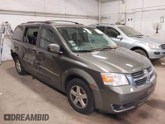 2010 Dodge Grand Caravan SXT with VIN 2D4RN5D14AR416488, listed as a IAAI auction lot 38412602 with 136,997 mi miles and . Bid and sale history available at DreamBid. Image 1.