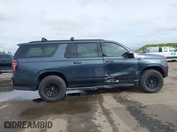 2021 Chevrolet Suburban Z71 with VIN 1GNSKDKD2MR379098, listed as a IAAI auction lot 41836921 with 53,532 mi miles and . Bid and sale history available at DreamBid. Image 13.