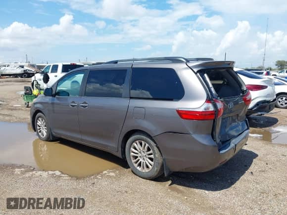 2015 Toyota Sienna XLE with VIN 5TDYK3DC7FS662215, listed as a IAAI auction lot 43208864 with 142,089 mi miles and . Bid and sale history available at DreamBid. Image 3.
