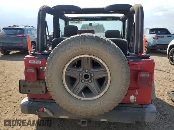 2003 Jeep Wrangler X z VIN 1J4FA39S33P308881, wystawiony jako Copart lot #69323655 z przebiegiem 264 257 mil mil oraz Szkoda całkowita • Salvage title. Historia ofert i sprzedaży dostępna na DreamBid. Obrazek 6.