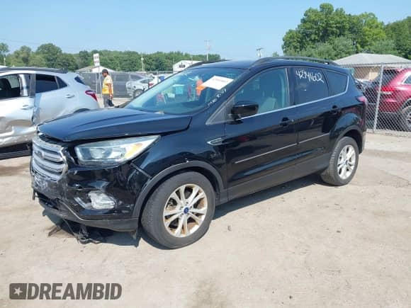 2018 Ford Escape SE with VIN 1FMCU9GD8JUC47268, listed as a IAAI auction lot 42941602 with 87,617 mi miles and . Bid and sale history available at DreamBid. Image 2.