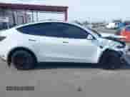2023 Tesla Model Y Long Range with VIN 7SAYGDEE7PA124885, listed as a IAAI auction lot 43084065 with 22,983 mi miles and . Bid and sale history available at DreamBid. Image 14.