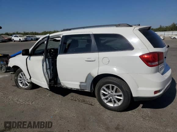 2014 Dodge Journey SXT with VIN 3C4PDCBG4ET296732, listed as a Copart auction lot 67479975 with 244,286 mi miles and Salvage title. Bid and sale history available at DreamBid. Image 2.