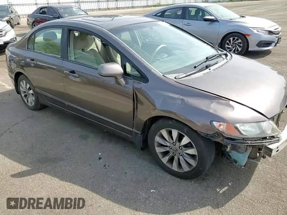 2010 Honda Civic with VIN 19FXA1F8XAE019092, listed as a Copart auction lot 71496354 with 185,077 mi miles and Salvage title. Bid and sale history available at DreamBid. Image 11.