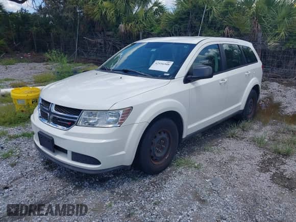2012 Dodge Journey SE z VIN 3C4PDCABXCT255928, wystawiony jako IAAI lot #42536508 z przebiegiem 148 167 mil mil oraz . Historia ofert i sprzedaży dostępna na DreamBid. Obrazek 2.