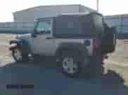 2016 Jeep Wrangler Willys Wheeler with VIN 1C4AJWAG4GL119680, listed as a Copart auction lot 65416205 with 96,057 mi miles and Salvage title. Bid and sale history available at DreamBid. Image 2.