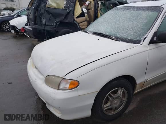 1999 Hyundai Accent GL z VIN KMHVF24N1XU583604, wystawiony jako IAAI lot #41613240 z przebiegiem 163 938 mil mil oraz . Historia ofert i sprzedaży dostępna na DreamBid. Obrazek 13.