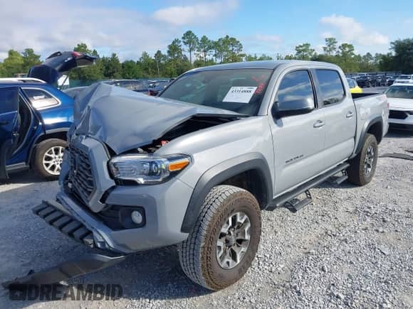 2021 Toyota Tacoma SR with VIN 3TYCZ5ANXMT024937, listed as a IAAI auction lot 43314888 with 77,580 mi miles and . Bid and sale history available at DreamBid. Image 2.